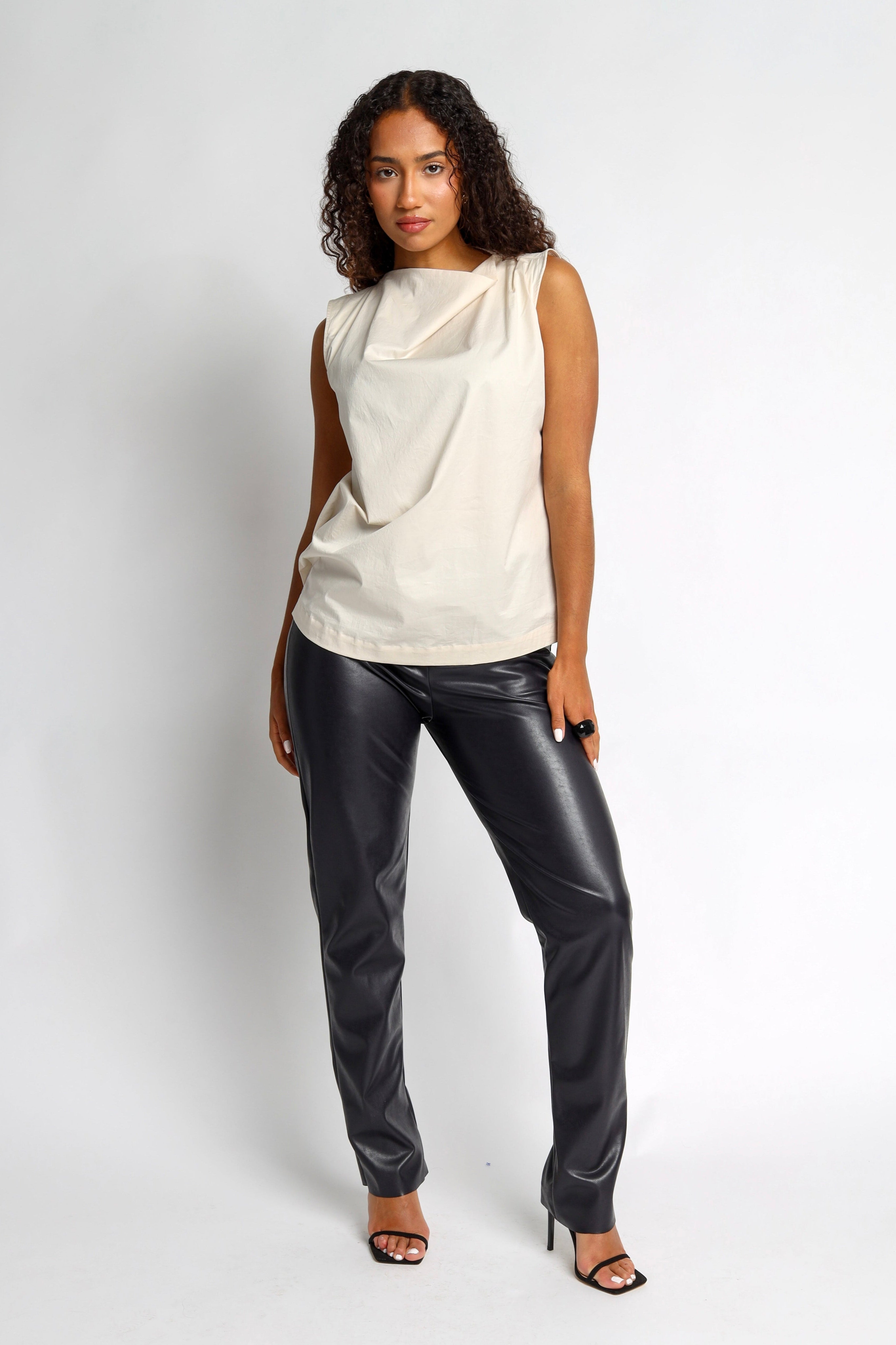 sleeveless blouse with bateau neckline